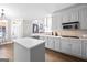 Spacious kitchen with island, stainless steel appliances and hardwood floors at 295 Camden Creek Ct, Lawrenceville, GA 30043