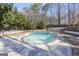 Inviting kidney-shaped pool surrounded by a spacious patio at 295 Camden Creek Ct, Lawrenceville, GA 30043