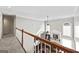 View from upper hallway overlooking living room and entryway at 295 Camden Creek Ct, Lawrenceville, GA 30043