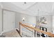 Upper hallway with arched window and view of entryway at 295 Camden Creek Ct, Lawrenceville, GA 30043