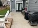 Backyard patio with grill and artificial turf at 10 Plum Blossom Ln, Hampton, GA 30228