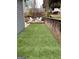 Artificial turf backyard with seating area at 10 Plum Blossom Ln, Hampton, GA 30228
