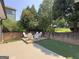 Brick patio with seating area and artificial turf at 10 Plum Blossom Ln, Hampton, GA 30228