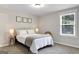 Bright bedroom with a queen-size bed and large window at 10 Plum Blossom Ln, Hampton, GA 30228