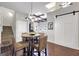 Casual dining area with a small table and four chairs, adjacent to the living room at 10 Plum Blossom Ln, Hampton, GA 30228
