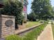 Landscaped front yard with brick columns and walkway at 10 Plum Blossom Ln, Hampton, GA 30228