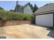 Attached garage with white door and driveway at 10 Plum Blossom Ln, Hampton, GA 30228