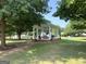 Community gazebo with seating, brick base, and green roof at 10 Plum Blossom Ln, Hampton, GA 30228