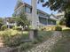 Side view of gray house with rock pathway and landscaping at 10 Plum Blossom Ln, Hampton, GA 30228