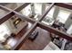 High-ceilinged living room with exposed wooden beams and a brick fireplace at 10 Plum Blossom Ln, Hampton, GA 30228