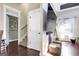 Living room features a staircase, a door, and hardwood floors at 10 Plum Blossom Ln, Hampton, GA 30228