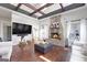 Large living room with a brick fireplace, hardwood floors, and high ceilings at 10 Plum Blossom Ln, Hampton, GA 30228