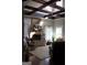 Living room with a brick fireplace, hardwood floors, and a cozy sitting area at 10 Plum Blossom Ln, Hampton, GA 30228