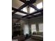 Living room with a brick fireplace, hardwood floors, and high ceilings at 10 Plum Blossom Ln, Hampton, GA 30228