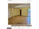 Spacious basement room with wood floors and window at 6045 Winview Dr, Forest Park, GA 30297