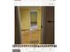 Open doorway to a basement room with wood floors at 6045 Winview Dr, Forest Park, GA 30297