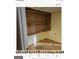 Basement room with built-in wooden shelving at 6045 Winview Dr, Forest Park, GA 30297