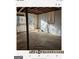 Unfinished basement with concrete floor and storage at 6045 Winview Dr, Forest Park, GA 30297