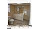 Basement bathroom with vanity, toilet, and mirror at 6045 Winview Dr, Forest Park, GA 30297
