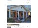 Brick ranch house with covered porch and columns at 6045 Winview Dr, Forest Park, GA 30297