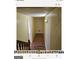 Hallway with wood-look flooring and access to stairs at 6045 Winview Dr, Forest Park, GA 30297