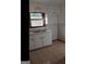 Simple kitchen with white cabinets and double sink at 6045 Winview Dr, Forest Park, GA 30297