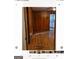 Living room with hardwood floors and wood paneling at 6045 Winview Dr, Forest Park, GA 30297