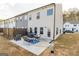 Private patio with concrete slab, fire pit, and seating area at 4937 Lower Elm St, South Fulton, GA 30349