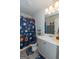' bathroom with sports-themed decor and shower/tub combo at 4937 Lower Elm St, South Fulton, GA 30349