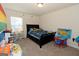 bedroom with a bed, playful decor, and educational elements at 4937 Lower Elm St, South Fulton, GA 30349