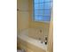 Bathroom with soaking tub and updated fixtures at 161 Revolutionary Dr, Hampton, GA 30228