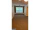 Cozy bedroom with built-in shelves and a large window at 161 Revolutionary Dr, Hampton, GA 30228