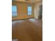 Large bedroom with neutral carpeting and ample natural light at 161 Revolutionary Dr, Hampton, GA 30228