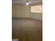 Spacious bonus room with neutral carpeting and a window at 161 Revolutionary Dr, Hampton, GA 30228