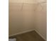 Walk-in closet with wire shelving and carpeted floor at 161 Revolutionary Dr, Hampton, GA 30228