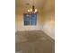 Bright dining room with chandelier and wainscoting at 161 Revolutionary Dr, Hampton, GA 30228