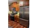 Modern kitchen features stainless steel appliances and wood cabinets at 161 Revolutionary Dr, Hampton, GA 30228