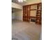 Living room with fireplace and built-in wooden shelving unit at 161 Revolutionary Dr, Hampton, GA 30228