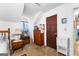 Bedroom with wooden dresser and view into another room at 75 Antioch Rd, Mcdonough, GA 30252