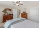 Bedroom with double bed, dresser, and access to bathroom at 109 Faversham Dr, Mcdonough, GA 30252