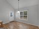 Bright dining area with hardwood floors and a door to the backyard at 1293 Coan Dr, Locust Grove, GA 30248