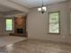 Open living room featuring brick fireplace, updated ceiling fan and natural light at 232 Darwish Dr, Mcdonough, GA 30252