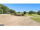 Landscaped driveway entrance with a scenic golf course view at 248 Montrose Dr, Mcdonough, GA 30253