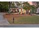 Brick home with circular driveway and manicured lawn at 248 Montrose Dr, Mcdonough, GA 30253