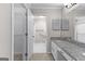 Bathroom featuring granite counters and doorway to separate room at 180 Lagrange Ct, Fayetteville, GA 30214