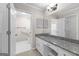 Updated bathroom with granite counters and ample storage space at 180 Lagrange Ct, Fayetteville, GA 30214