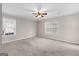 Bedroom featuring two windows and ceiling fan at 180 Lagrange Ct, Fayetteville, GA 30214