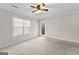Bedroom with carpet, ceiling fan, and access to the outside at 180 Lagrange Ct, Fayetteville, GA 30214