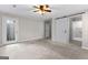 Bedroom featuring carpet, ceiling fan, and en-suite bathroom at 180 Lagrange Ct, Fayetteville, GA 30214