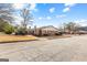 Brick home with a manicured lawn and mature trees at 180 Lagrange Ct, Fayetteville, GA 30214